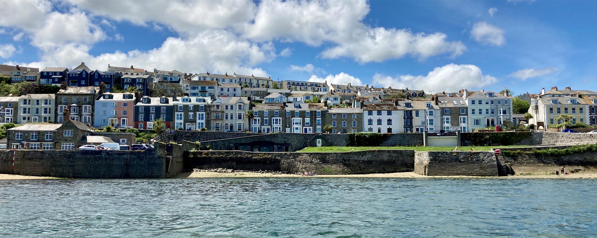 The waterfront of Falmouth, Cornwall, specifically the row of houses along Greenbank viewed from the water.